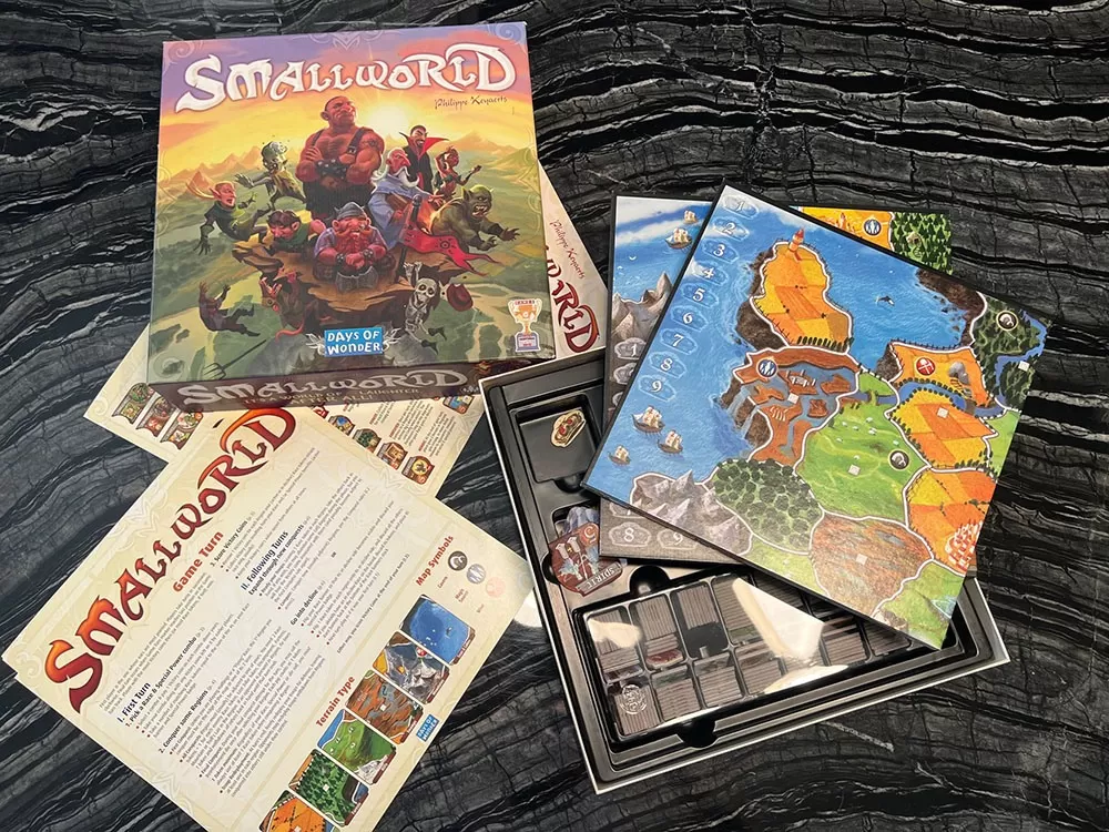 The Smallworld board game opened to reveal its contents.