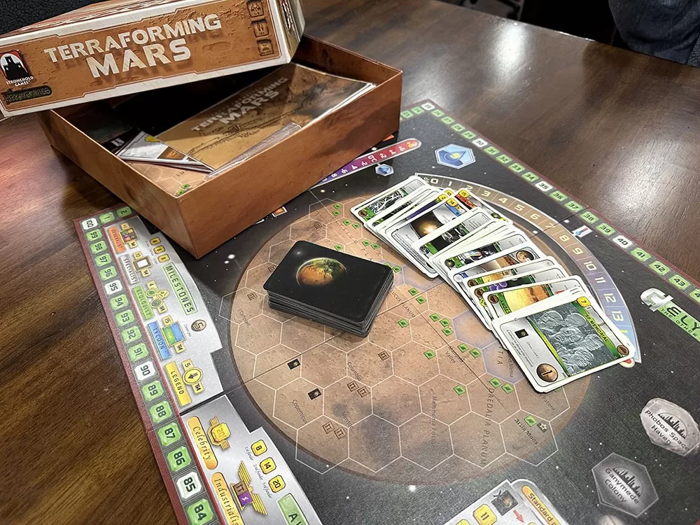 The Terraforming Mars board game opened to reveal its contents.